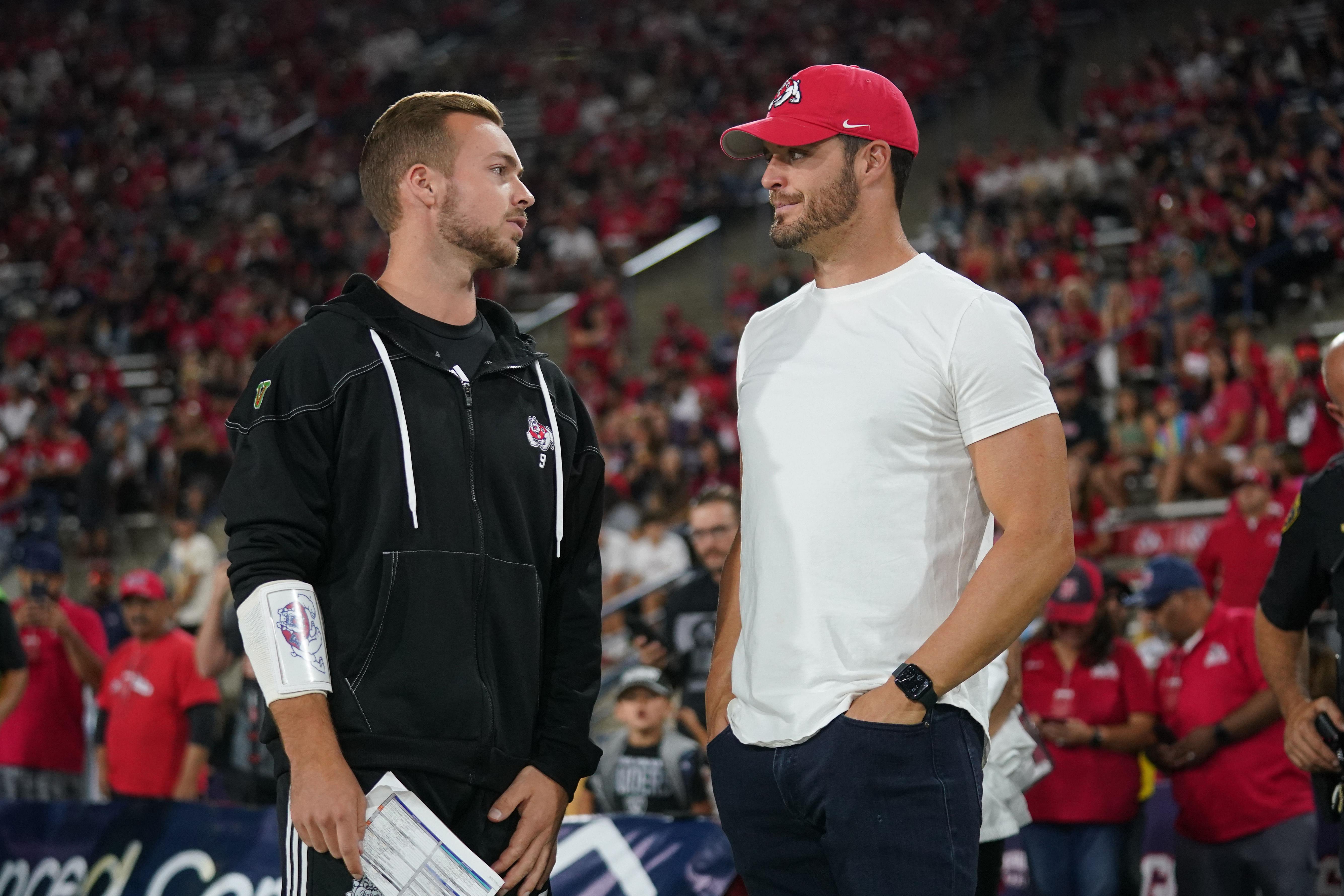 Jake Haener, left, meets with former Las Vegas Raiders quarterback Derek Carr - Source: Imagn